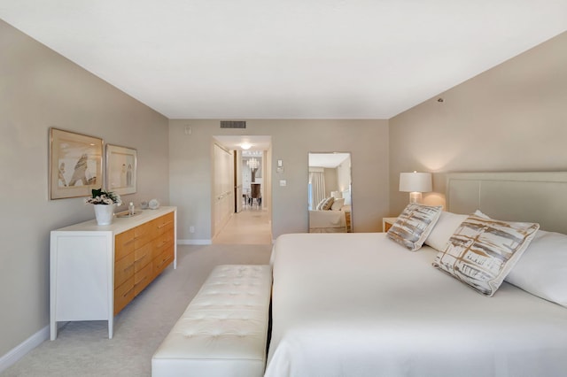 4545 N Ocean Blvd Unit 11C, Boca Raton, FL 33431 - bedroom with baseboards, light carpet, and visible vents