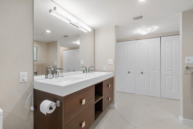 4545 N Ocean Blvd Unit 11C, Boca Raton, FL 33431 - bathroom with a sink, tile patterned flooring, double vanity, baseboards, and visible vents
