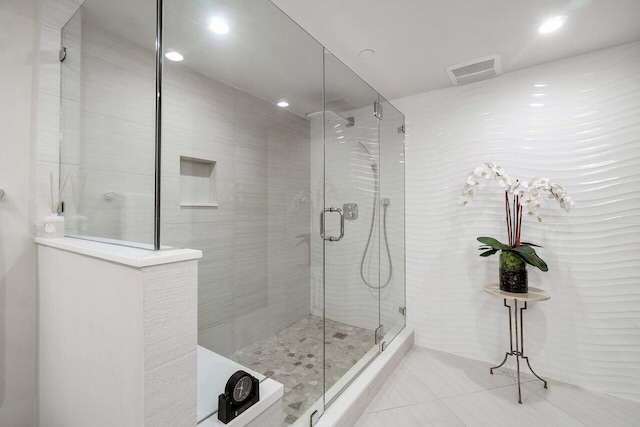 bathroom featuring tile patterned flooring and walk in shower