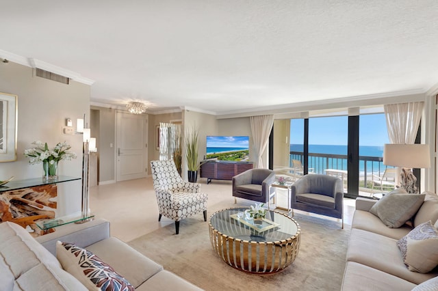 4545 N Ocean Blvd Unit 11C, Boca Raton, FL 33431 - living room with crown molding, a notable chandelier, visible vents, and a wall of windows
