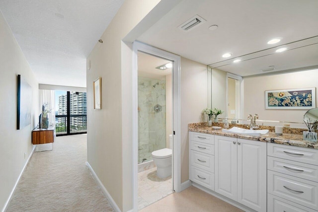 4545 N Ocean Blvd Unit 11C, Boca Raton, FL 33431 - full bathroom with visible vents, vanity, toilet, baseboards, and a stall shower