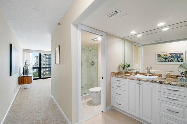 bathroom featuring walk in shower and toilet