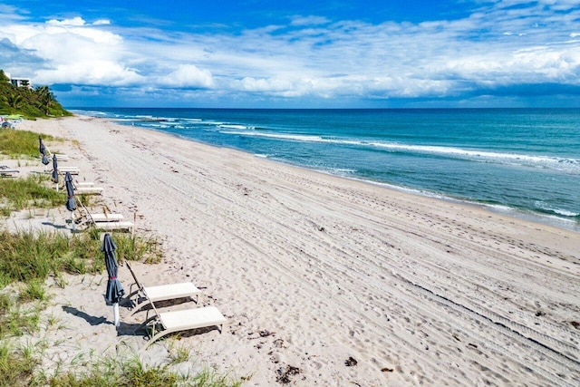 property view of water featuring a beach view