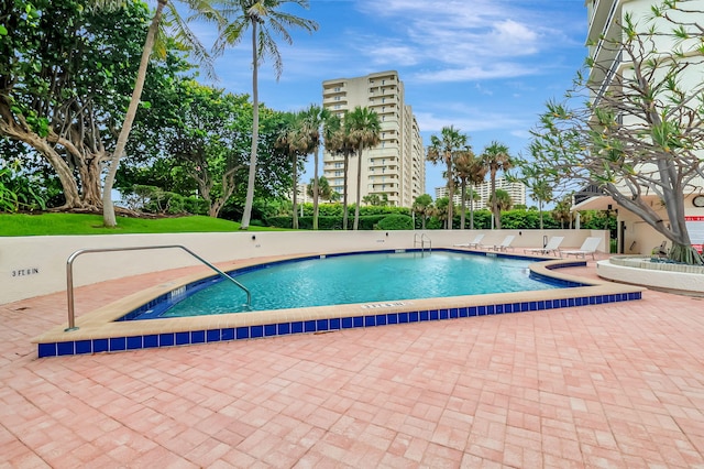 view of swimming pool with a patio area