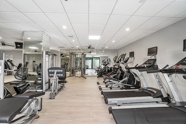 workout area with a paneled ceiling