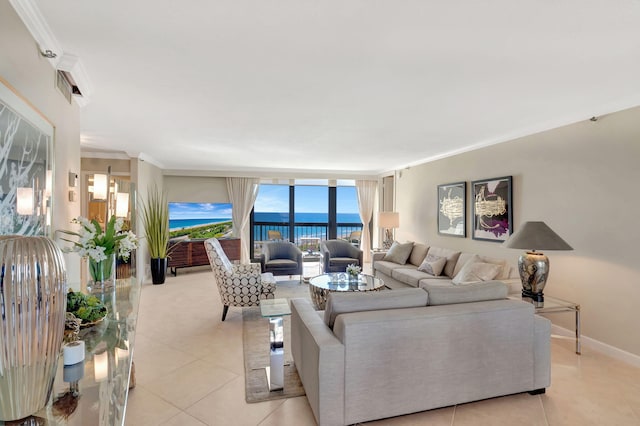 4545 N Ocean Blvd Unit 11C, Boca Raton, FL 33431 - living area with crown molding, a water view, baseboards, and light tile patterned floors