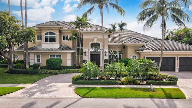 mediterranean / spanish house with a garage