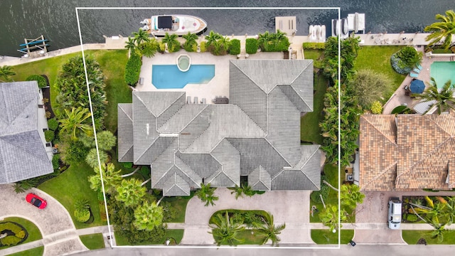 birds eye view of property featuring a water view