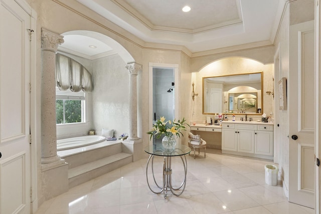 bathroom with vanity, a bath, tile patterned floors, crown molding, and decorative columns