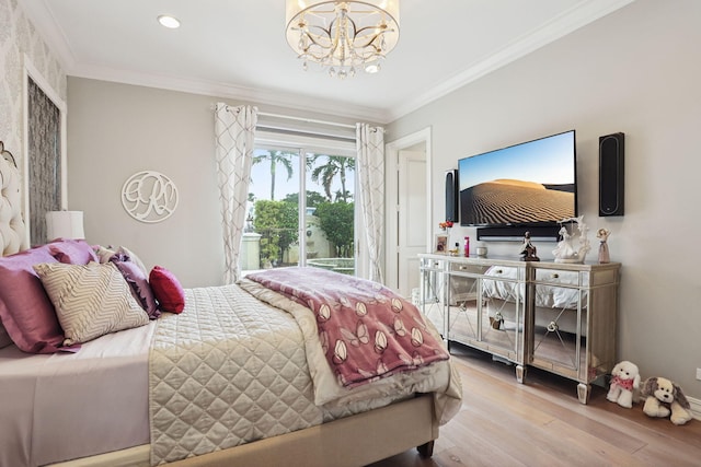 bedroom featuring crown molding, hardwood / wood-style floors, and an inviting chandelier