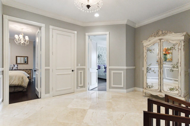 corridor featuring ornamental molding and a chandelier