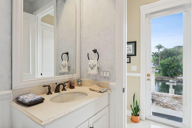 bathroom with a water view and vanity