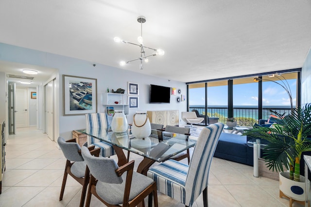 tiled dining area with floor to ceiling windows and an inviting chandelier