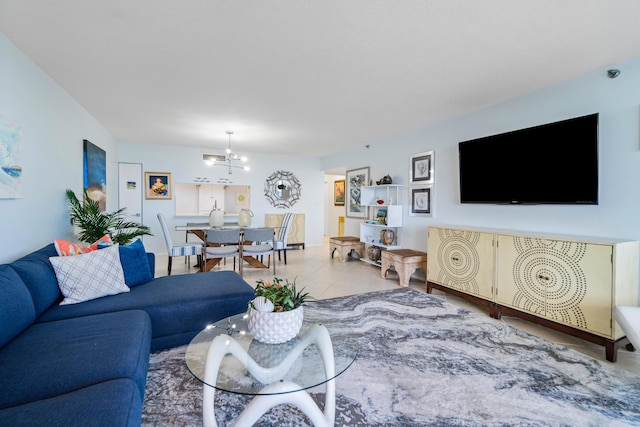 living room with light tile patterned floors and a notable chandelier