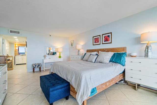 bedroom featuring light tile patterned floors