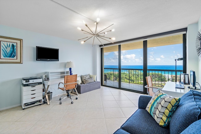 office area with an inviting chandelier, light tile patterned floors, and expansive windows