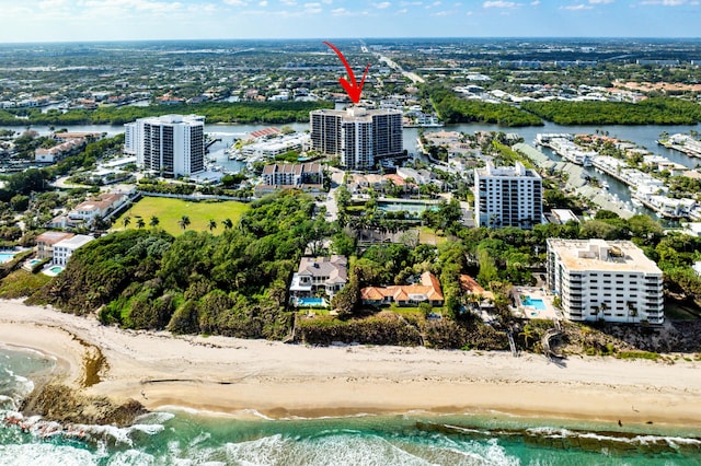 bird's eye view featuring a beach view and a water view