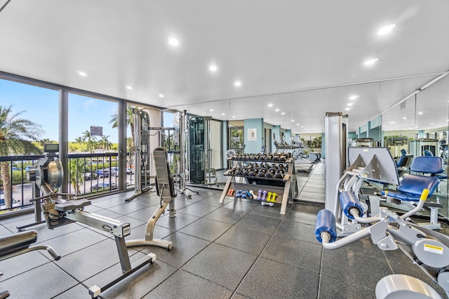 exercise room with floor to ceiling windows