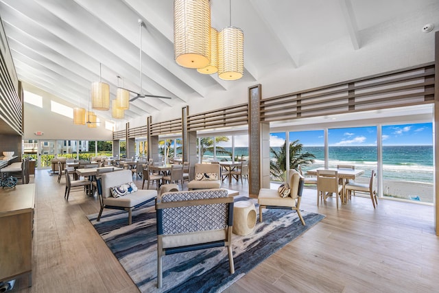 common area with a water view and a view of the beach