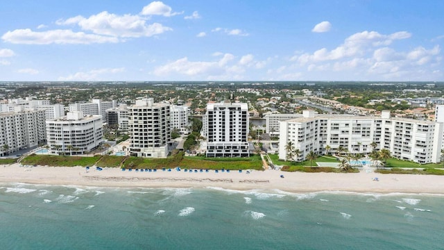 bird's eye view featuring a view of the beach and a water view