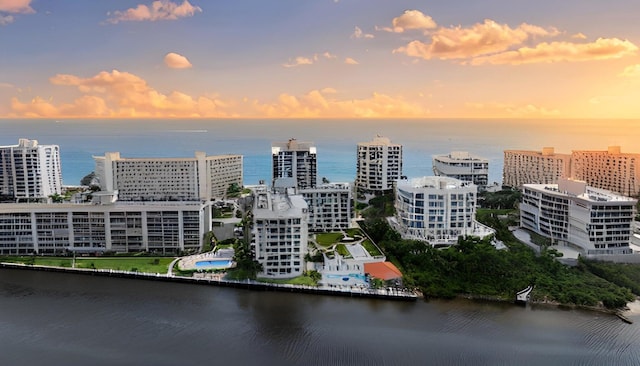 aerial view at dusk with a water view