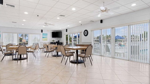 tiled dining room with ceiling fan