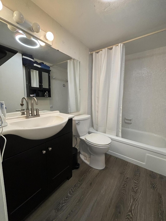 full bathroom featuring toilet, vanity, shower / bath combo, and hardwood / wood-style flooring