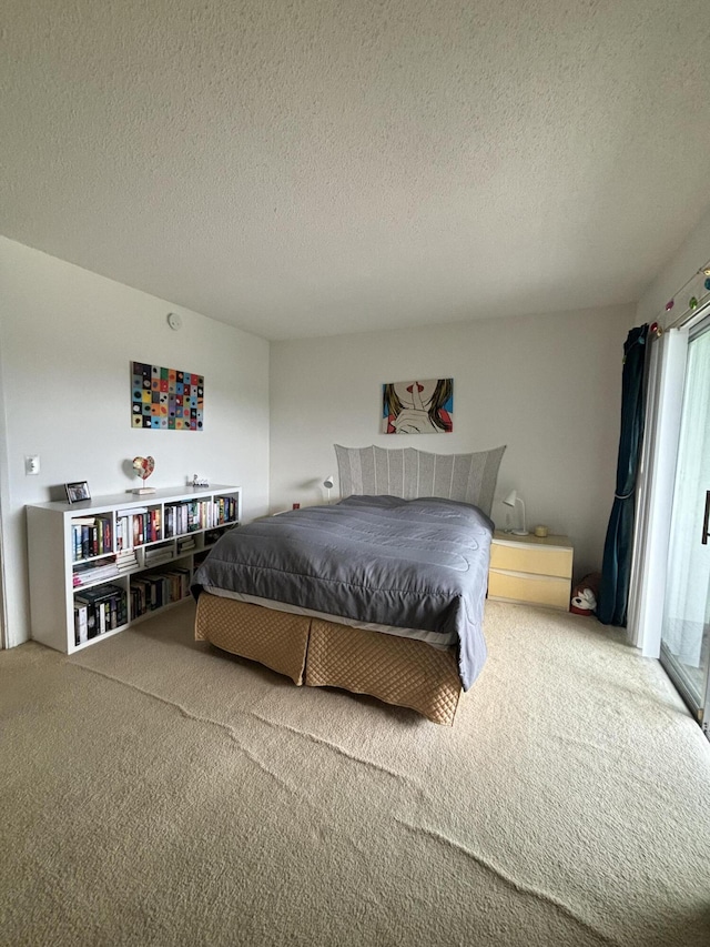 carpeted bedroom with a textured ceiling