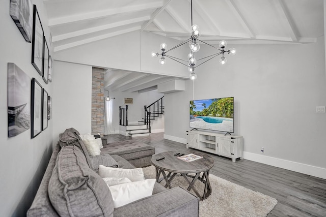 living room with hardwood / wood-style floors, beamed ceiling, a chandelier, and high vaulted ceiling