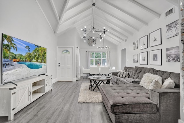 living room featuring a chandelier, beam ceiling, light wood-type flooring, and high vaulted ceiling