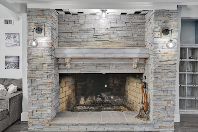 room details featuring a fireplace and hardwood / wood-style flooring