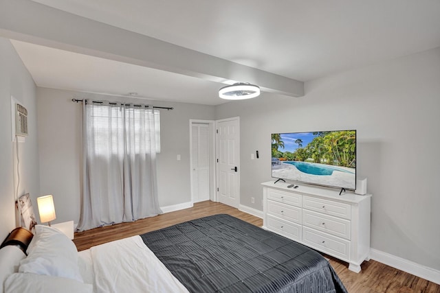 bedroom with hardwood / wood-style floors