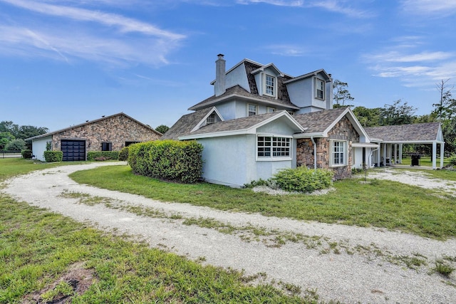 view of side of property featuring a yard