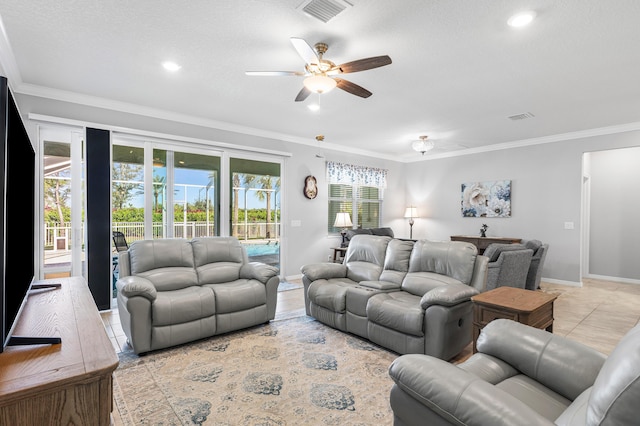 tiled living room with ceiling fan and crown molding