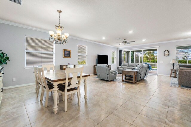 living room featuring light tile patterned floors, baseboards, visible vents, a ceiling fan, and crown molding