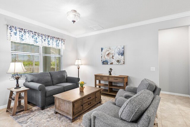 bedroom with ornamental molding, light wood-type flooring, a raised ceiling, and baseboards