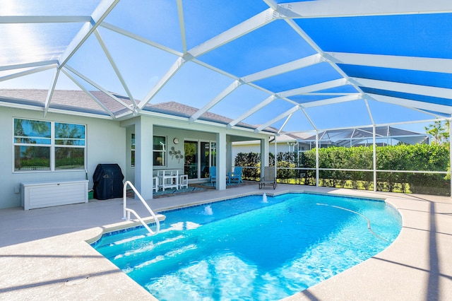 view of pool featuring glass enclosure, a grill, and a patio