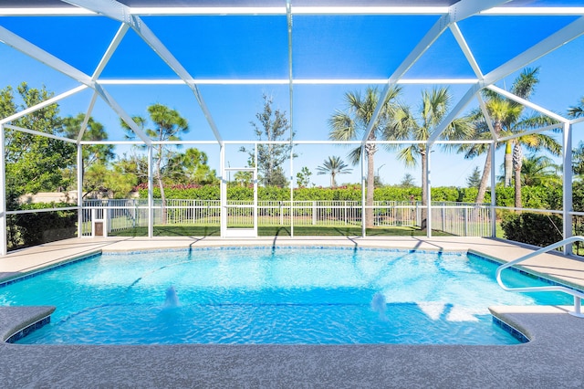 view of pool with a lanai, fence, a fenced in pool, and a patio