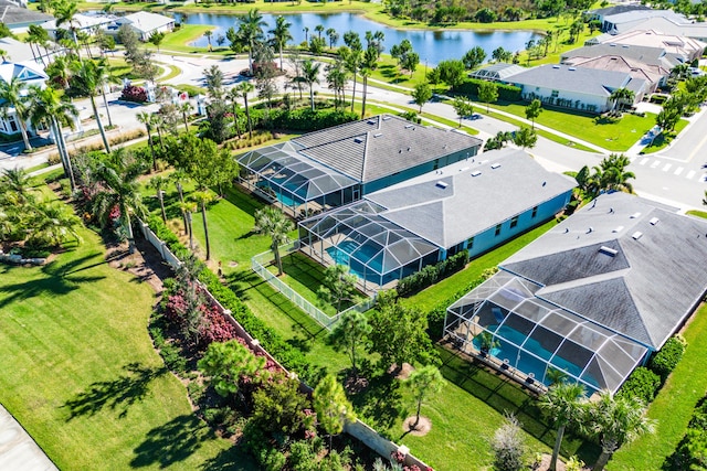 bird's eye view featuring a water view and a residential view