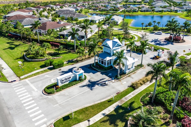 birds eye view of property with a residential view and a water view