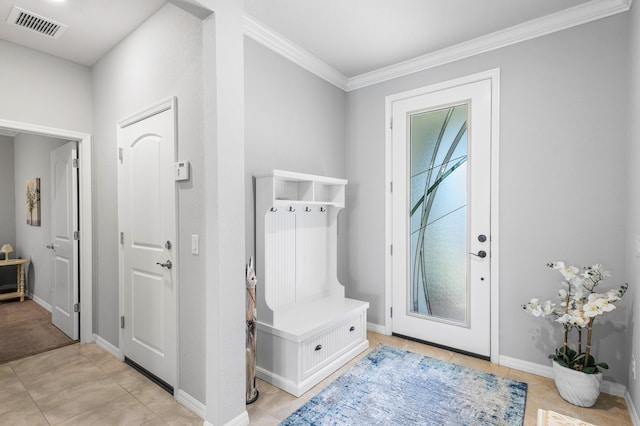 mudroom featuring baseboards, visible vents, crown molding, and light tile patterned flooring