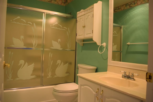 full bathroom featuring vanity, toilet, and enclosed tub / shower combo