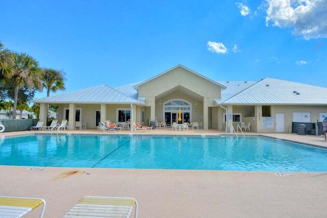 view of swimming pool with a patio