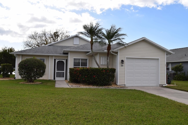 ranch-style home with a front lawn and a garage