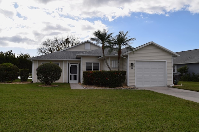 ranch-style house featuring a front lawn and a garage