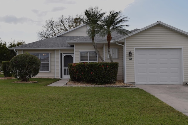 ranch-style home featuring a garage and a front lawn