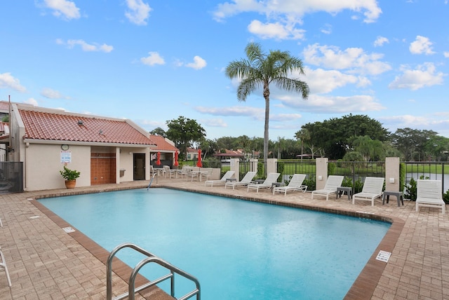 view of swimming pool featuring a patio