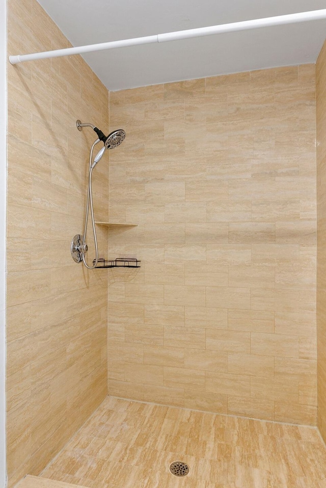 bathroom with a tile shower