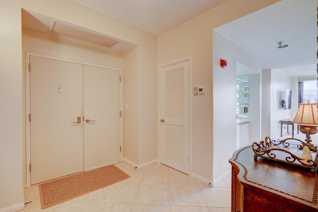 entrance foyer with light tile patterned floors