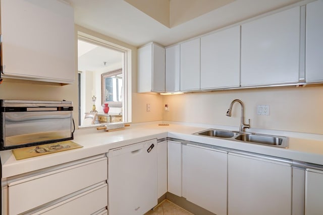 kitchen with dishwasher and white cabinets